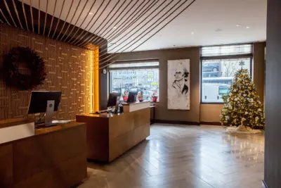 The Boerum — reception with wood detailing and warm finishes